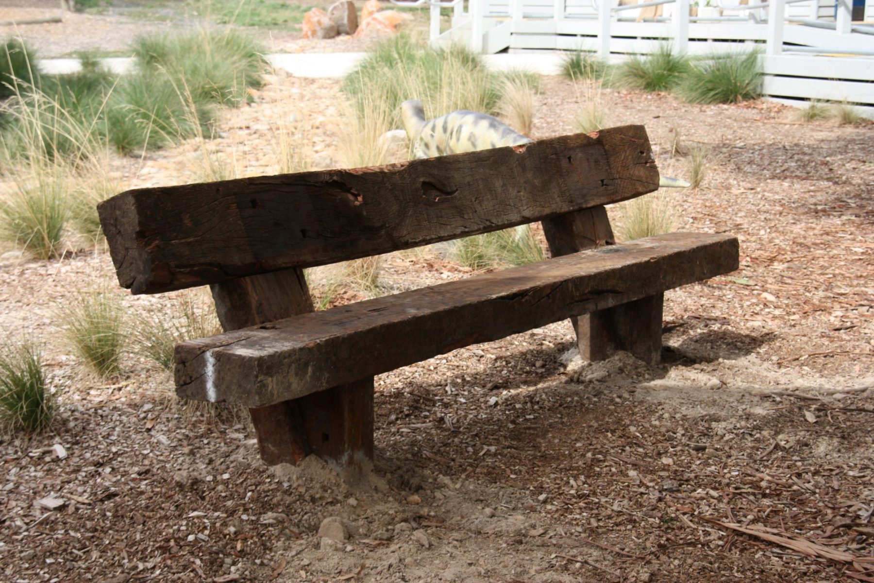 Handcrafted hardwood outdoor tables in a landscaped government precinct